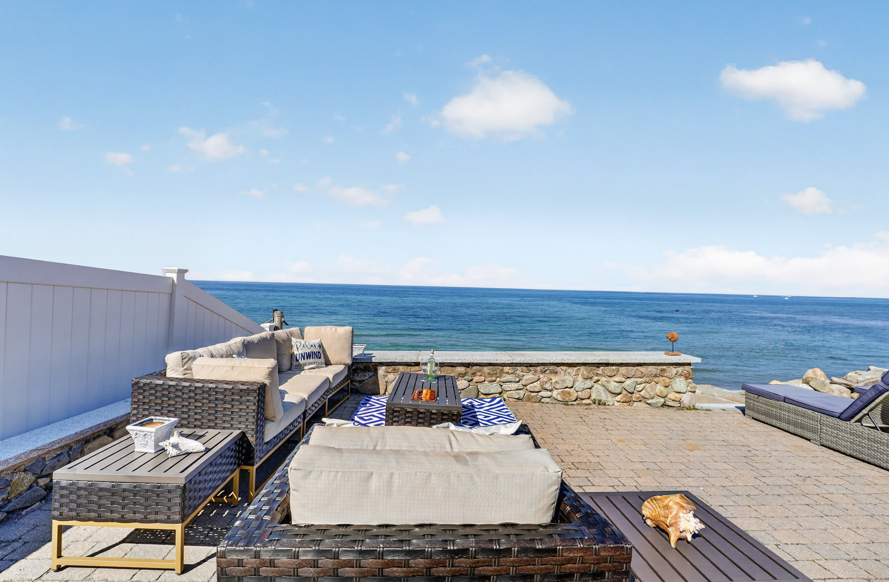 Take in panoramic waterfront views from the home's inviting outdoor living space.