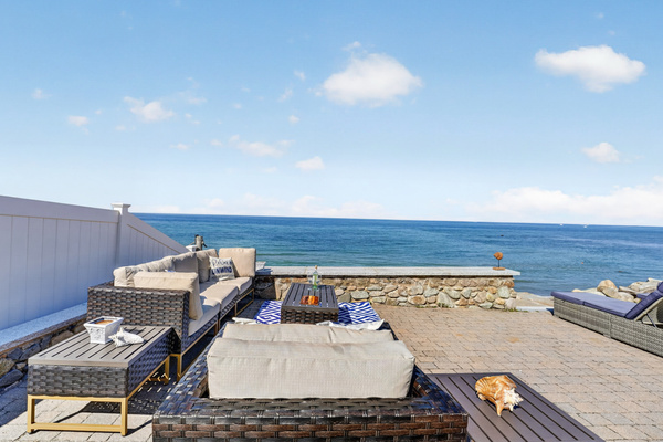 Take in panoramic waterfront views from the home's inviting outdoor living space.