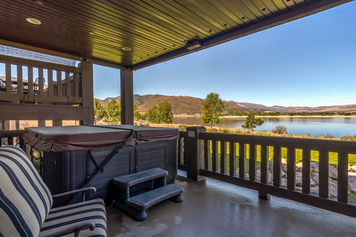 Private covered deck with hot tub—soak in the views of Pineview Reservoir and surrounding mountains.