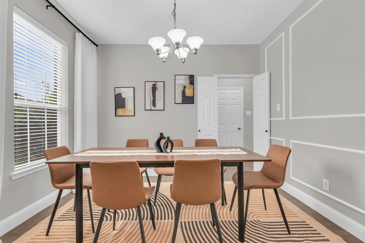Dedicated formal dining room with seating for seven, ideal for shared meals, celebrations, and group gatherings.