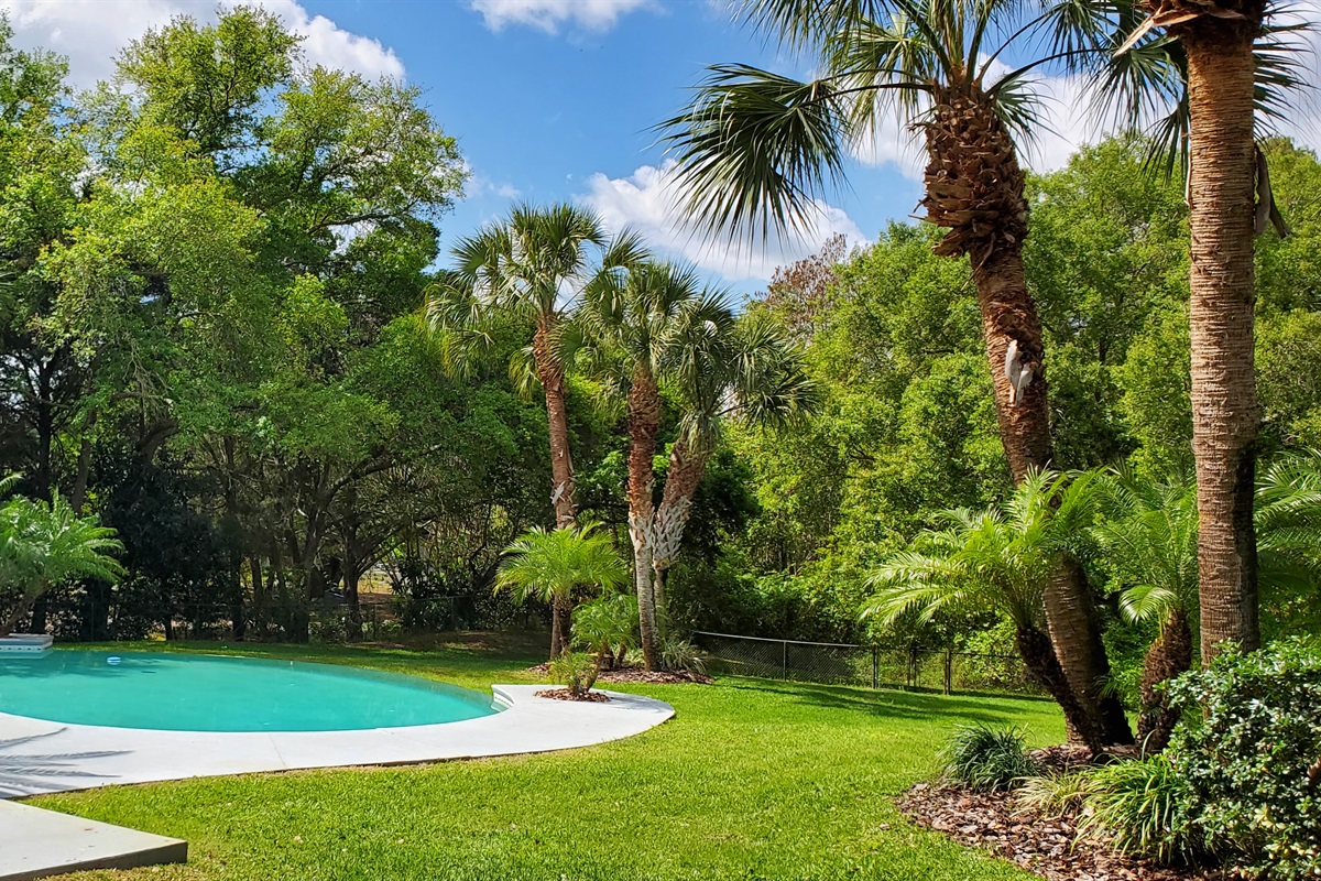 View of pool and fenced in backyard