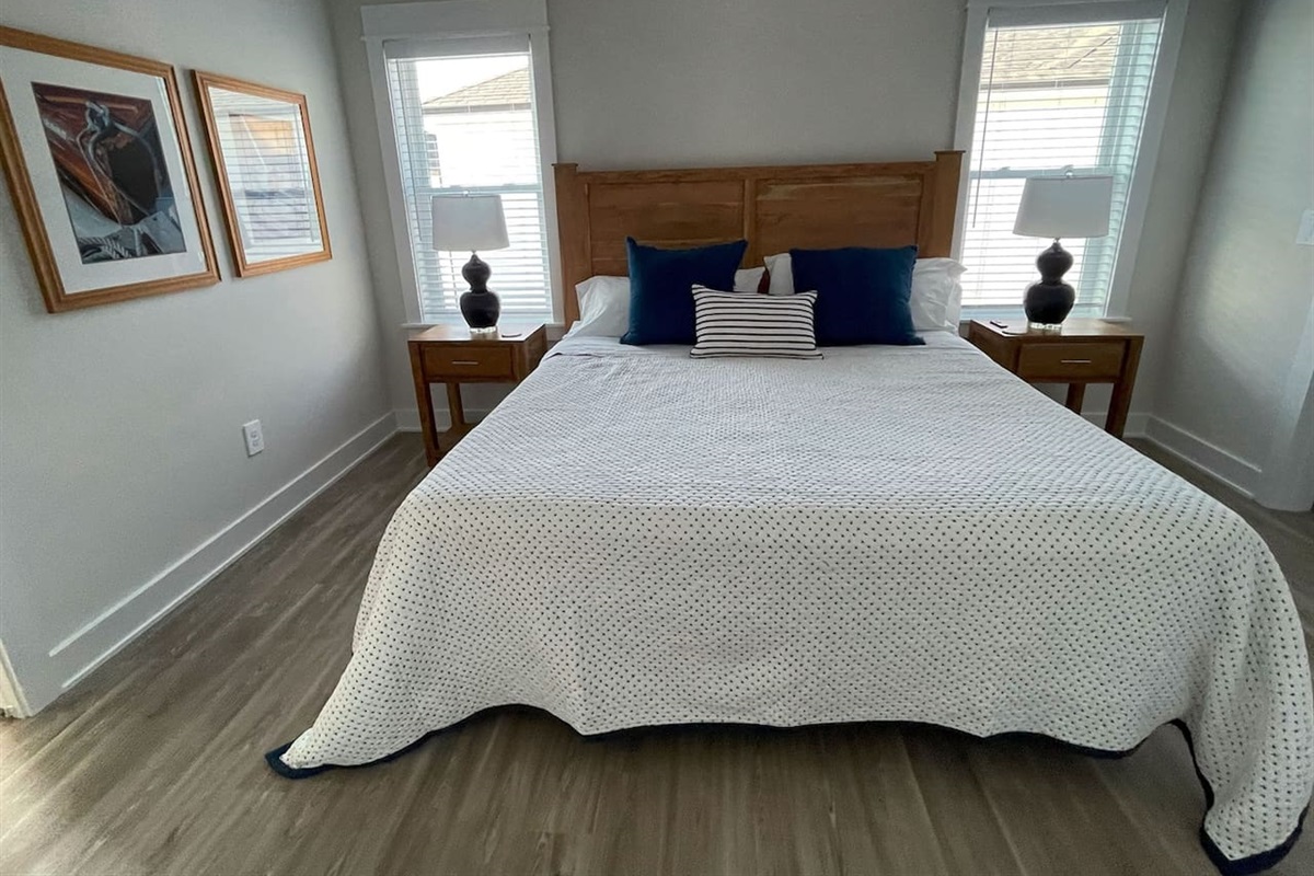 Comfortable and inviting second bedroom designed for a restful night’s sleep.