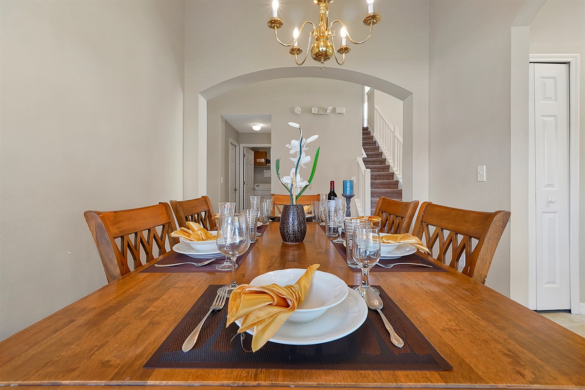 Gather for memorable meals around the generously-sized dining table, where comfortable seating and a full complement of stylish dinnerware ensure everyone can relax and connect. 