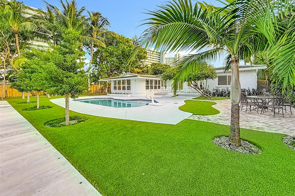 High end turf and beautiful landscaping make the pool area a great hang spot. 