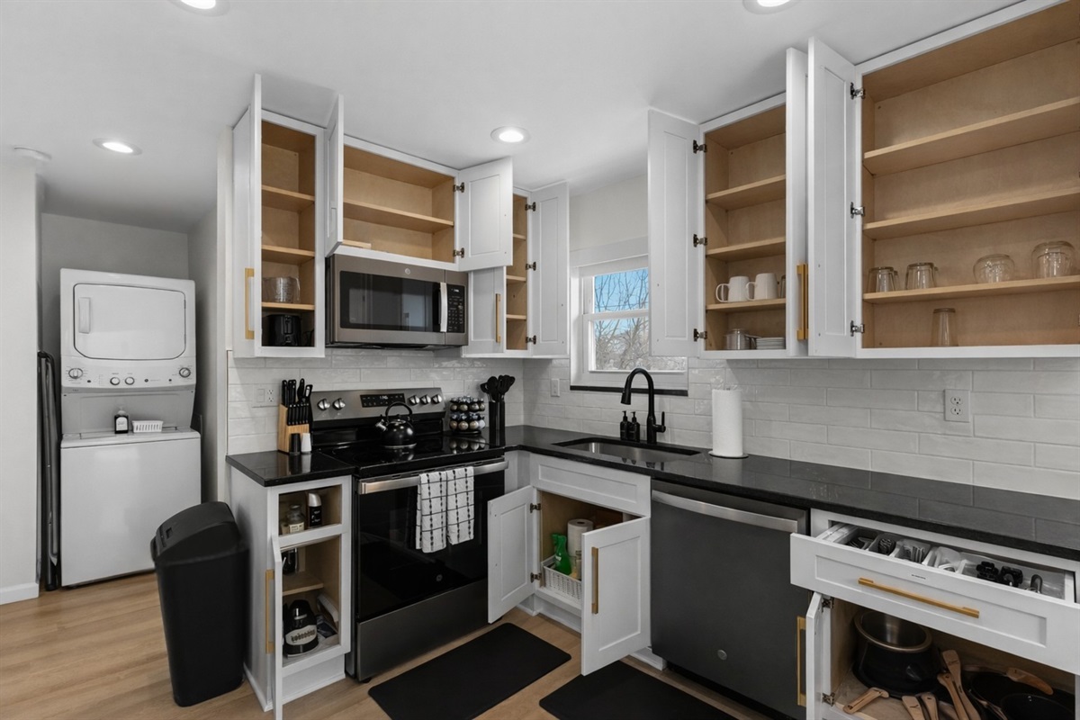 Fully stocked kitchen with ample cabinet space, cookware, and essentials—thoughtfully organized and ready for anything from quick bites to full meals.