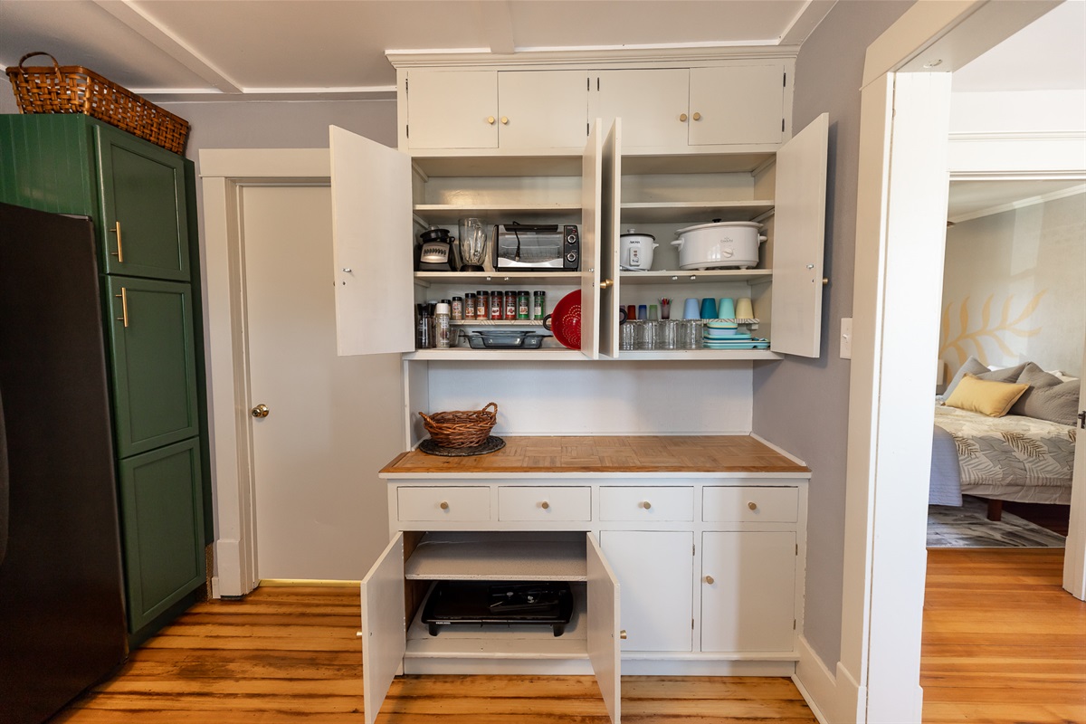 Blender, toaster oven, rice cooker, crock pot, kiddo plate ware, mason jars (our drinking glasses), an assortment of spices, coconut oil spray, pepper and pink Himalayan salt grinders. . .and