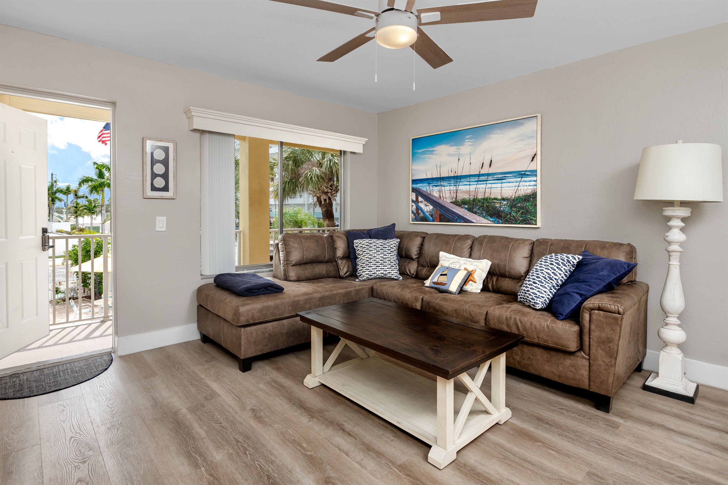 Living room and window overlooking the pool and a hideaway double bed