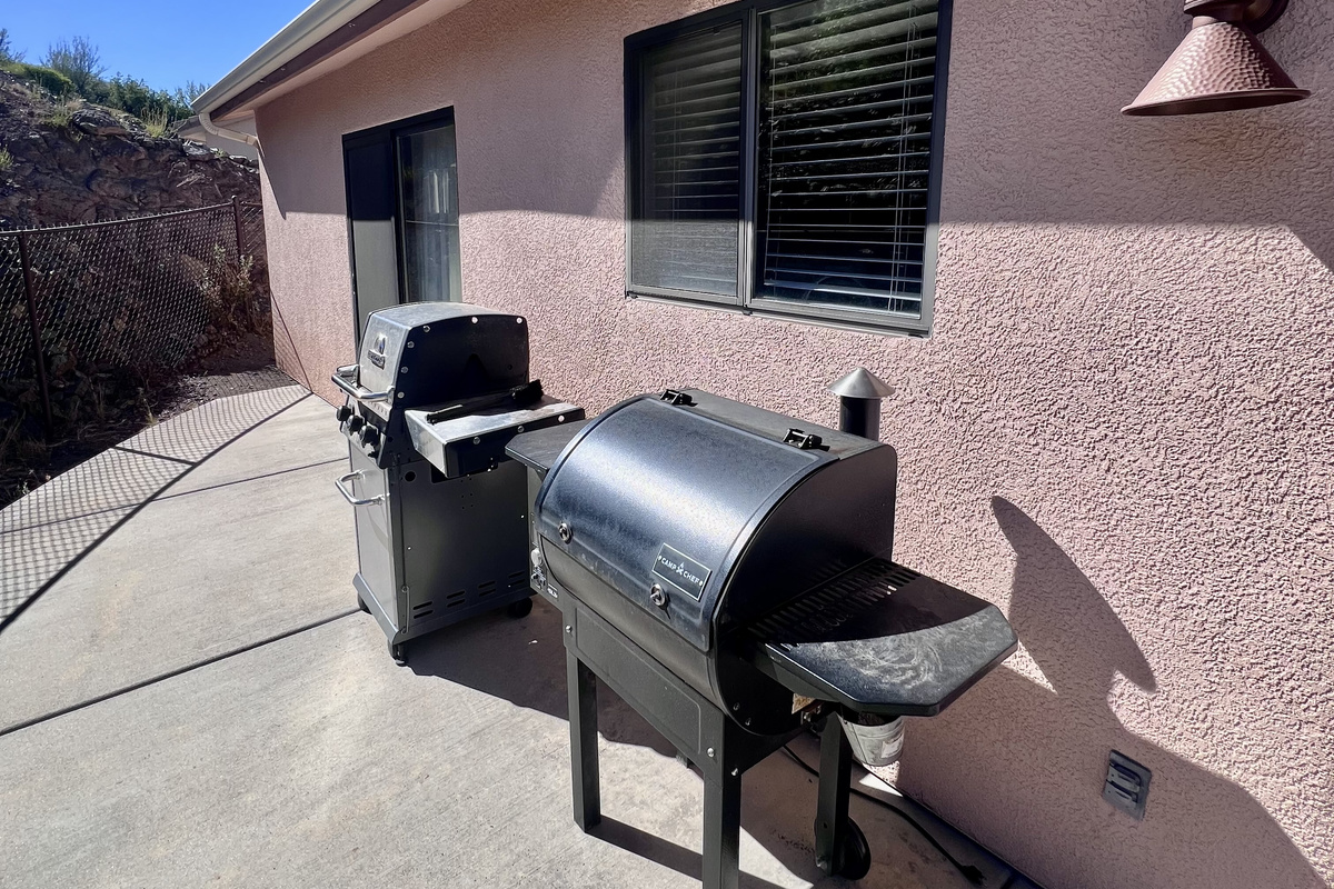 Fire up the full-size natural gas grill or slow cook in the pellet smoker and enjoy delicious BBQ meals on the patio!