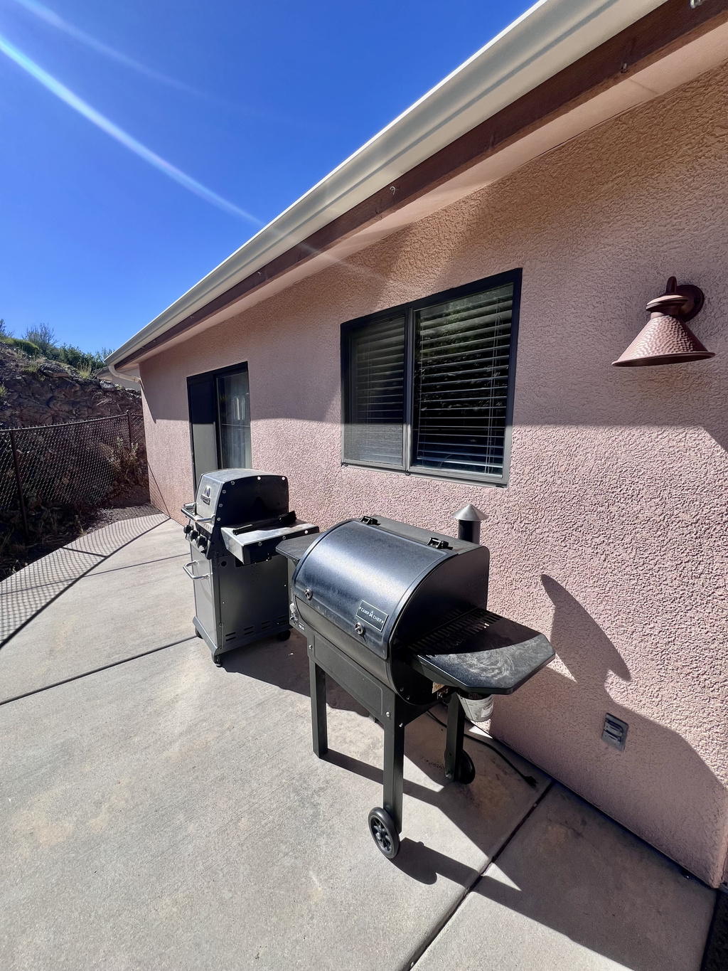 Fire up the full-size natural gas grill or slow cook in the pellet smoker and enjoy delicious BBQ meals on the patio!