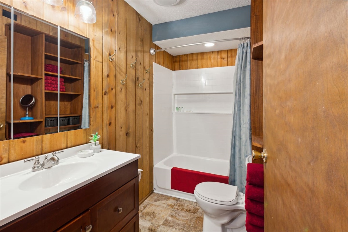 Full bathroom with large, deep bath tub to soak in, and a Bluetooth ceiling fan. Just turn the switch on and connect via your phone.