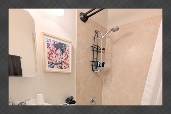 Full bathroom with tub/shower combo, water efficient toilet, fluffy towels, and fully stocked with toiletries and basic amenities. 