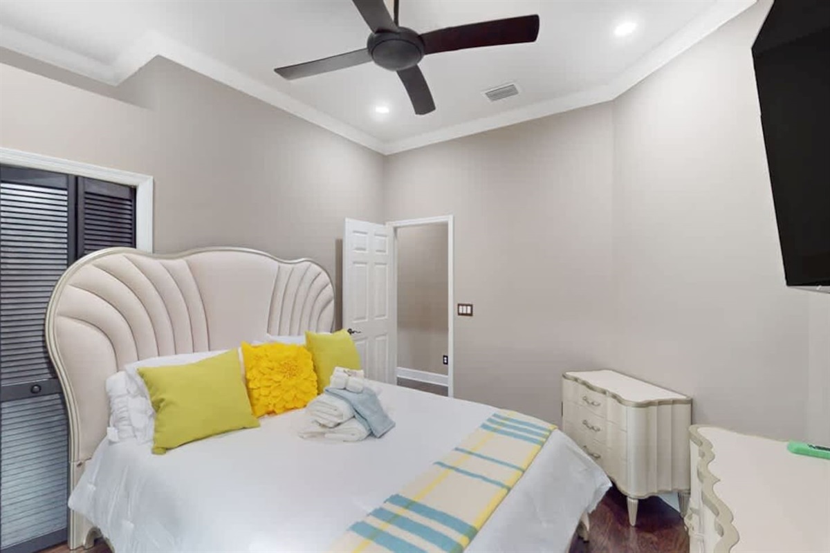 Sunny bedroom w/ simple, relaxing comfort.