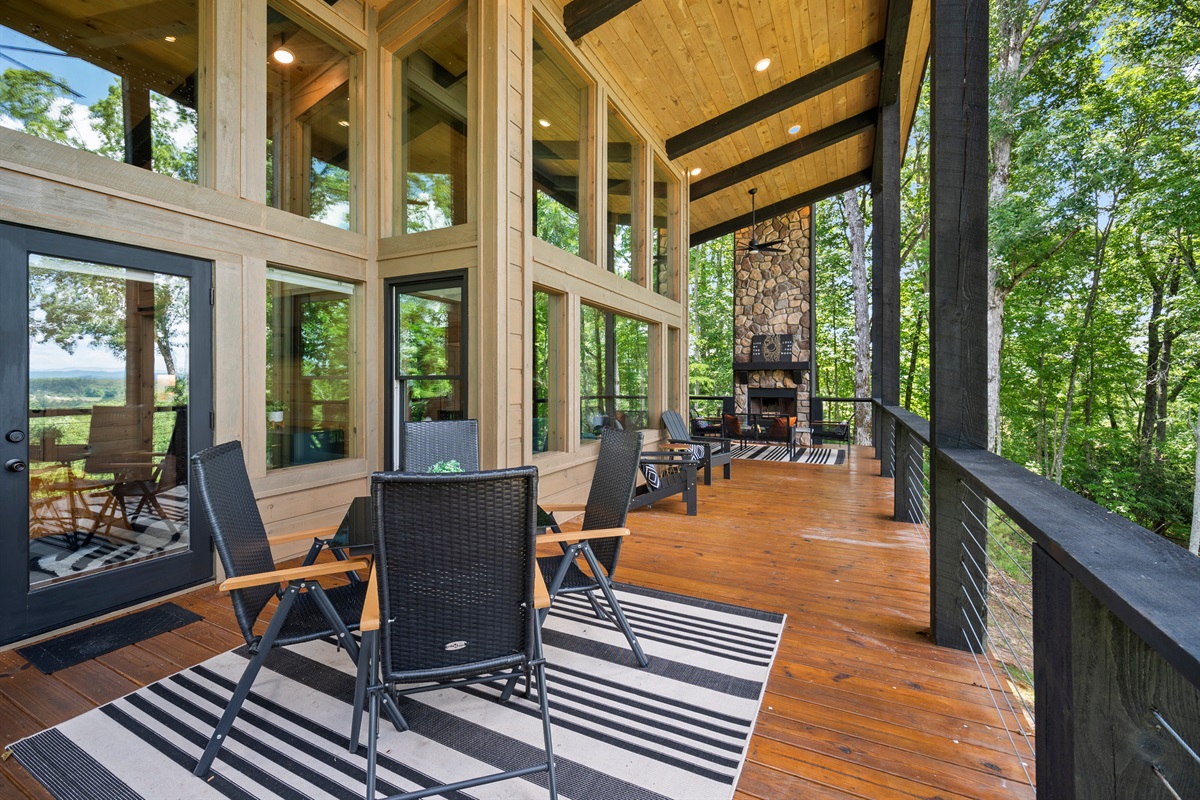 The expansive deck provides plenty of outdoor living space, with comfortable seating and panoramic views.