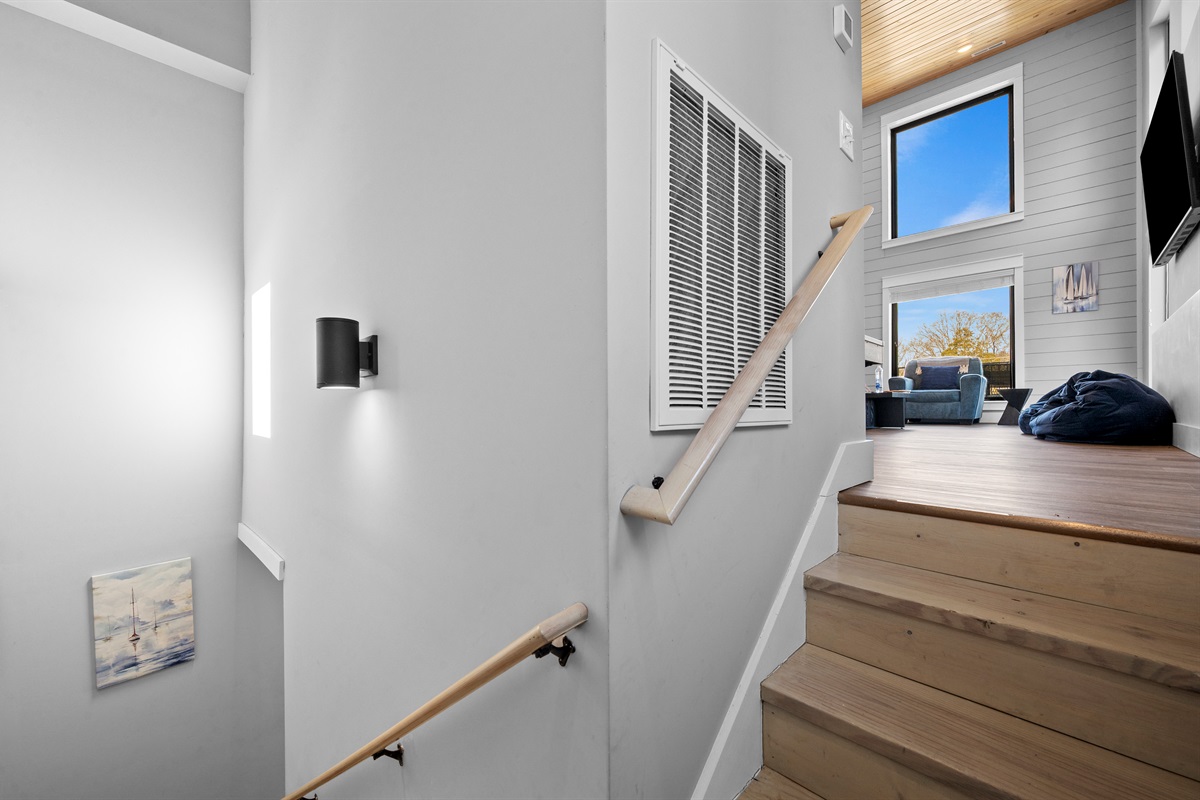 Interior stairwell with modern lighting and clean design, making movement between floors simple and safe.