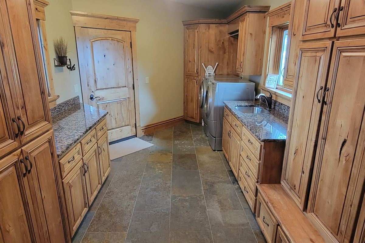 Nobody likes to do laundry, but this laundry room makes it a breeze!  Bonus: we provide the laundry pods, stain removal and other items to help you with your laundry!  

Plus there is plenty of cabinet space!