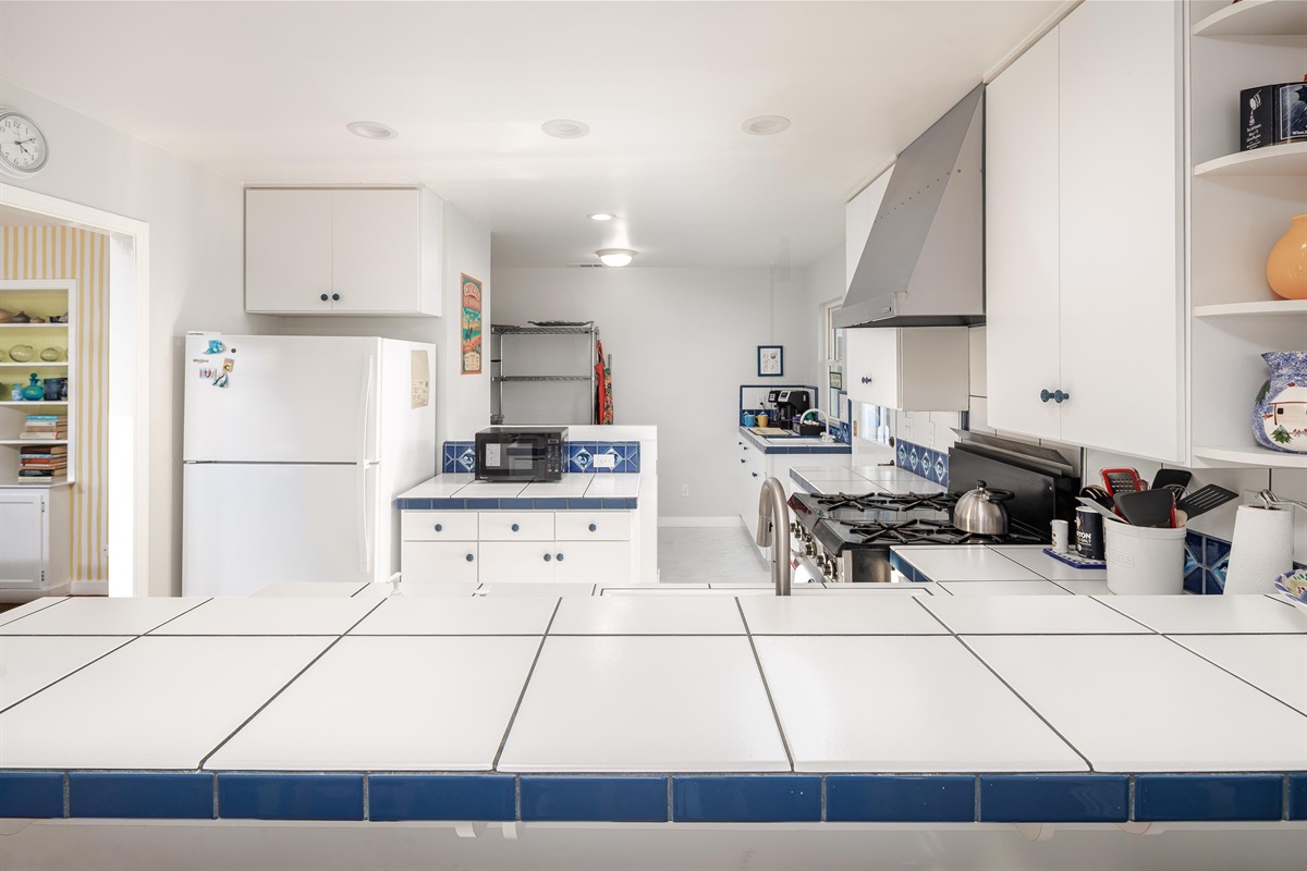 A big, welcoming kitchen and dining space made for cooking together, lingering over meals, and sharing stories from the day and enjoying the ocean view