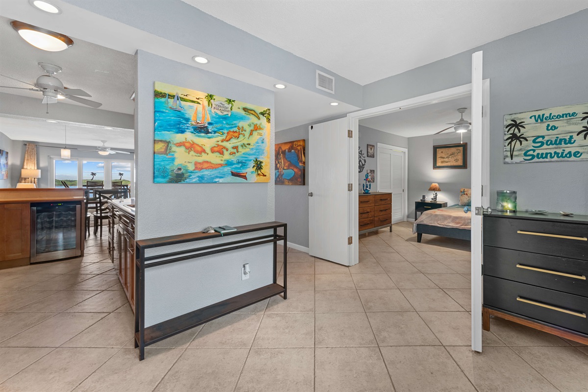 Spacious living area with charming archways and a seamless indoor-outdoor flow.