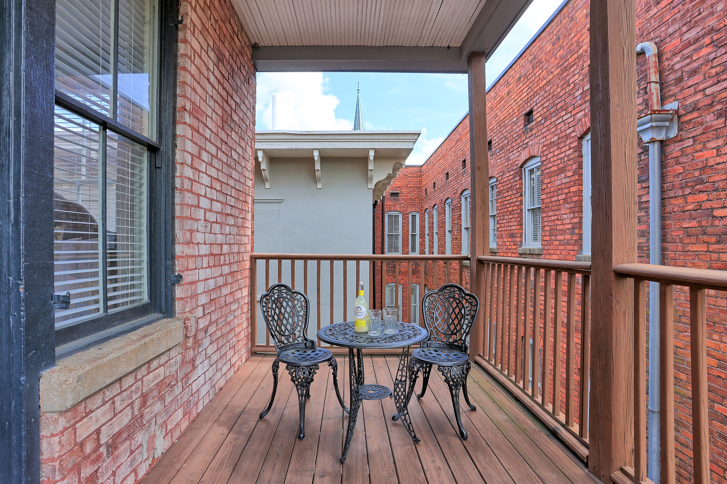 Enjoy quiet moments on your covered porch with seating for two.