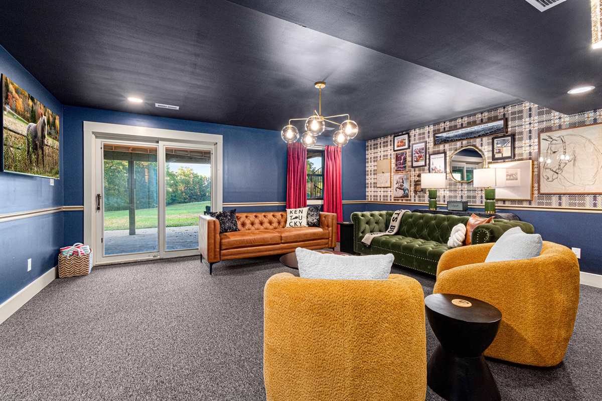 Loung adjacent to poker room leading to the hot tub, firepit, and pool area