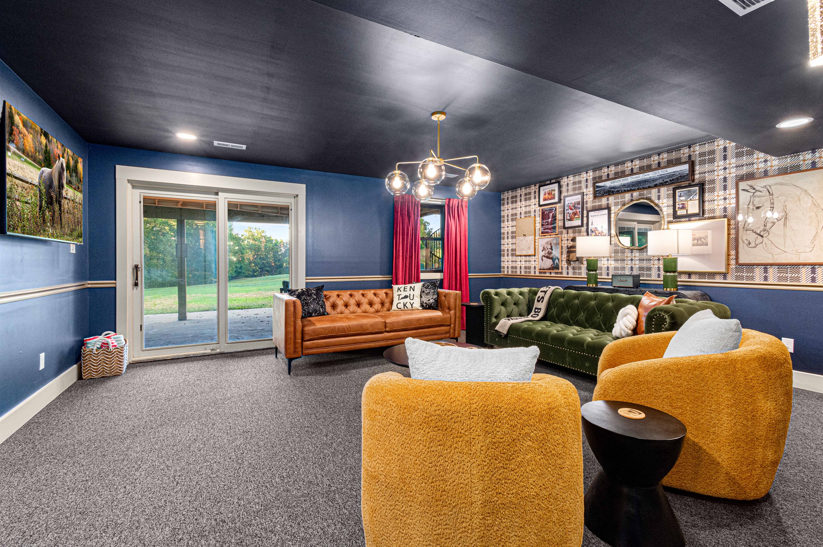 Loung adjacent to poker room leading to the hot tub, firepit, and pool area
