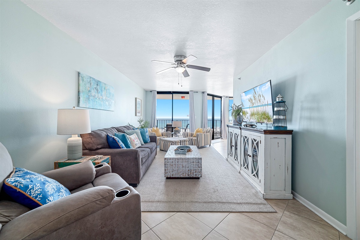 Your beachfront sanctuary. Featuring a cozy sleeper sofa, coastal-inspired decor, and seamless transition to the balcony overlooking the Gulf. Perfect for family gatherings and unforgettable sunsets.