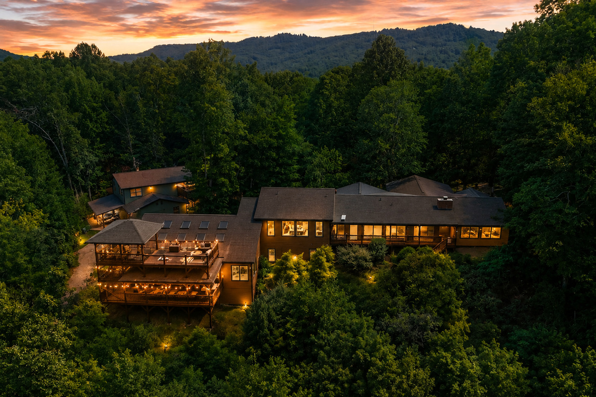 {Resort Exterior} Canopy Club glows at sunset with complete privacy, layered outdoor spaces, and sweeping forest views.