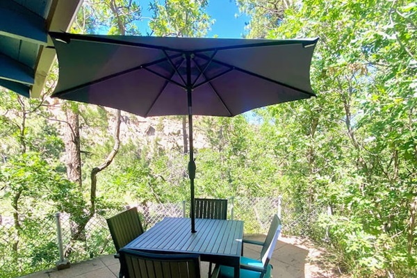 Enjoy meals outside by the gazebo overlooking the cliffside.