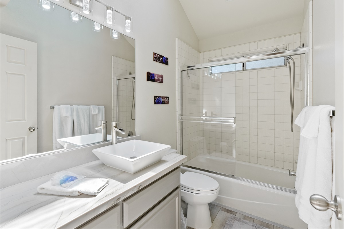 Refresh in this stylish space, with a glass-enclosed tub.
