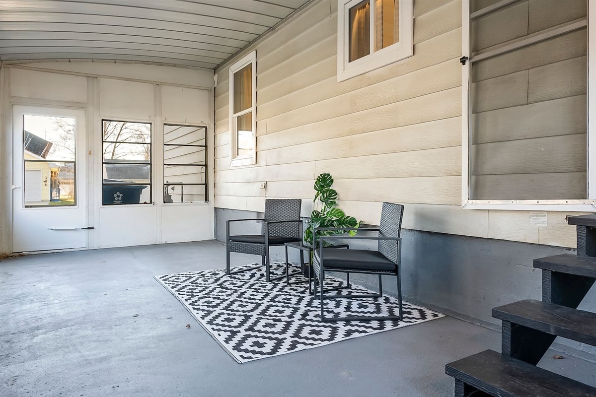 Spacious screened porch offering a shaded retreat with fresh air and privacy.