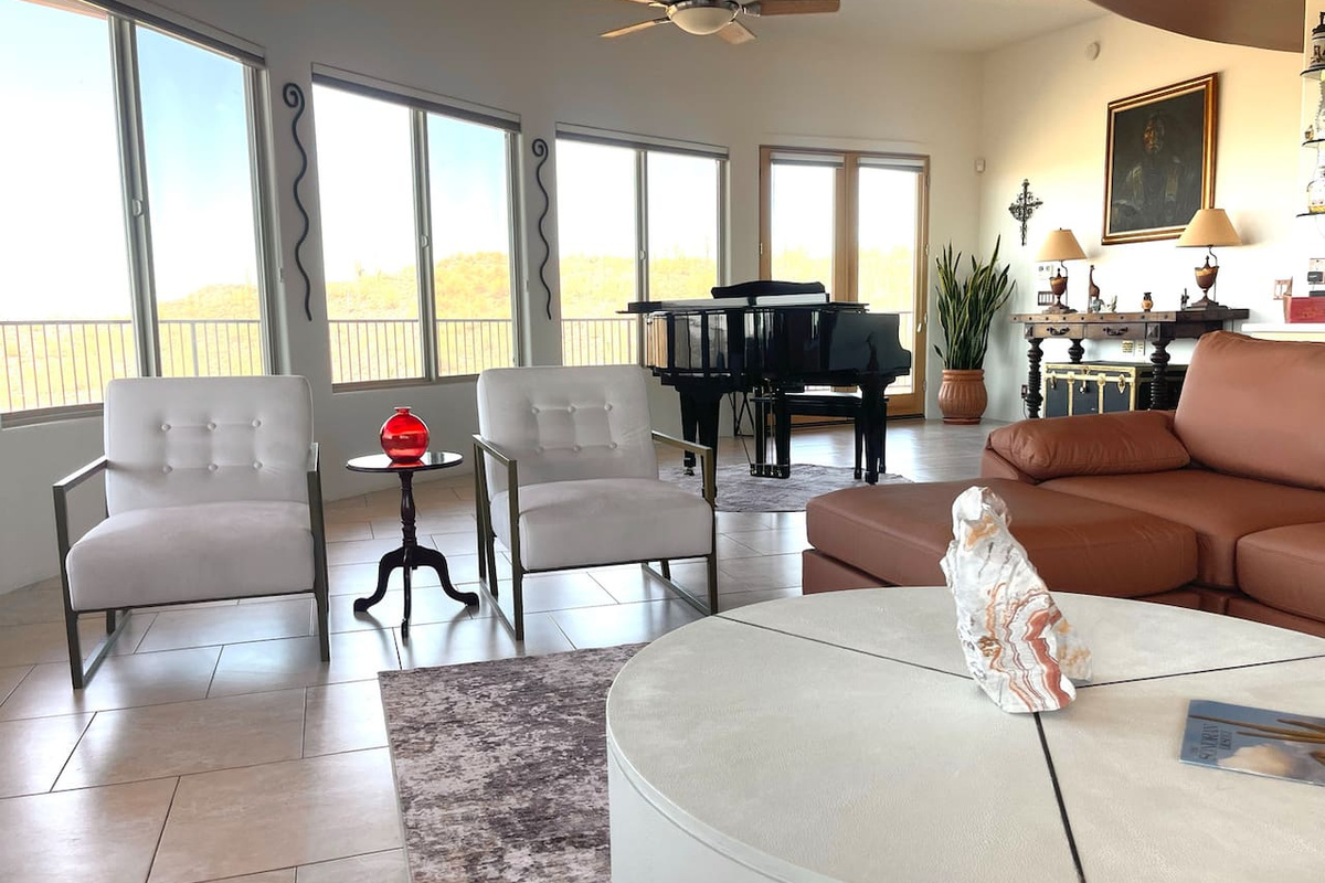 Conversation-friendly seating keeps the living area open and inviting, with the grand piano adding a distinctive touch.