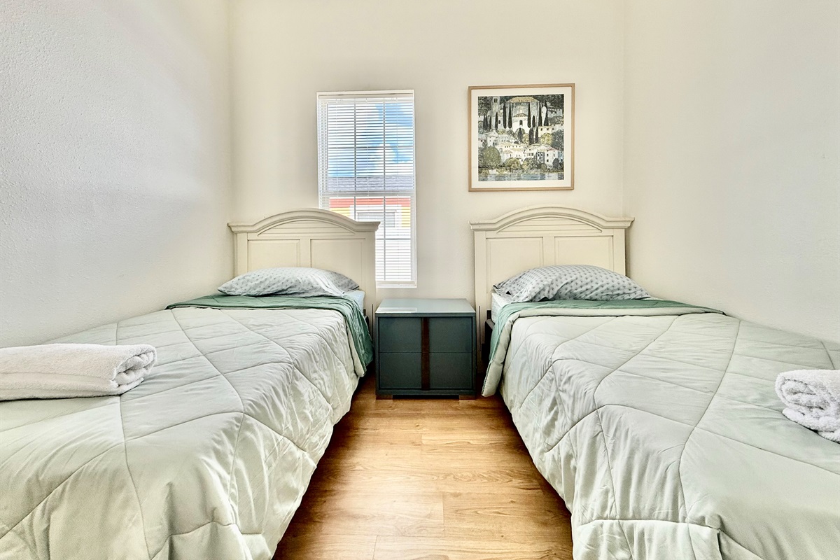 With two individual beds and ample floor space, this room is a great choice for families traveling with children.