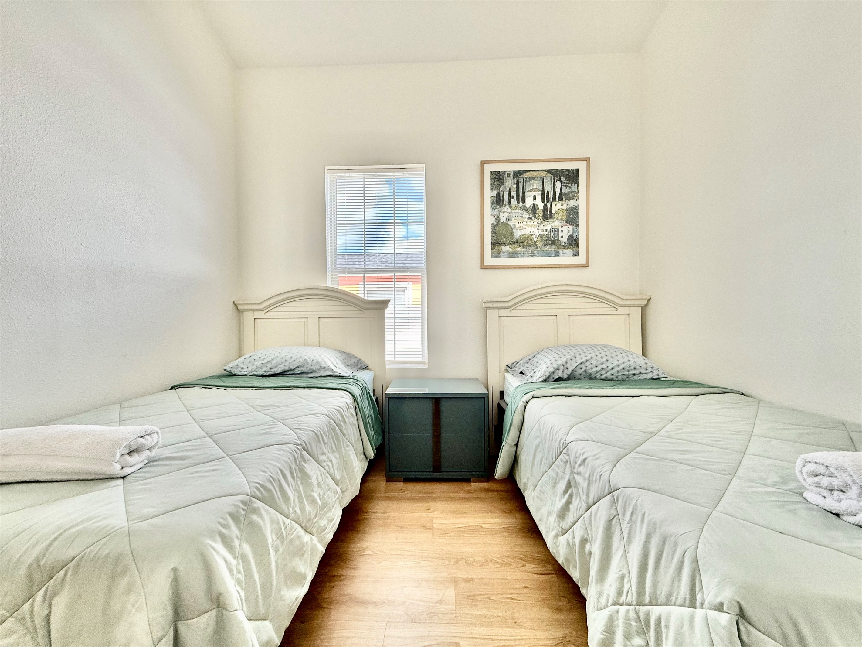 With two individual beds and ample floor space, this room is a great choice for families traveling with children.