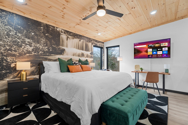 Wake up to treetop views in the spacious loft retreat with plush King bed, ensuite bathroom, and dedicated workspace. Note: Open to living area below.