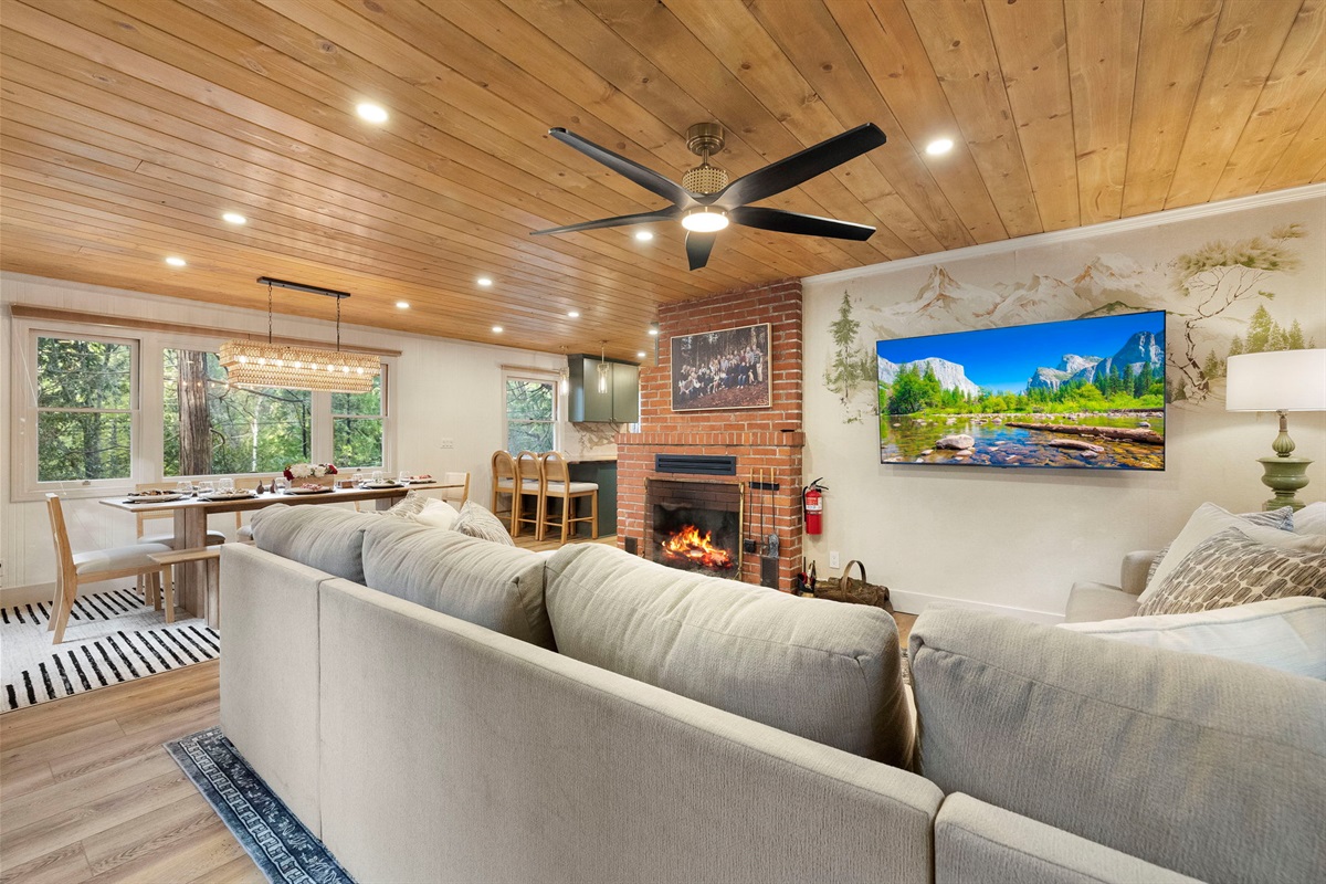 Open concept living with a combined living room, dining room and kitchen. Just enough division to feel like separate spaces and the perfect amount of openness to all be together.