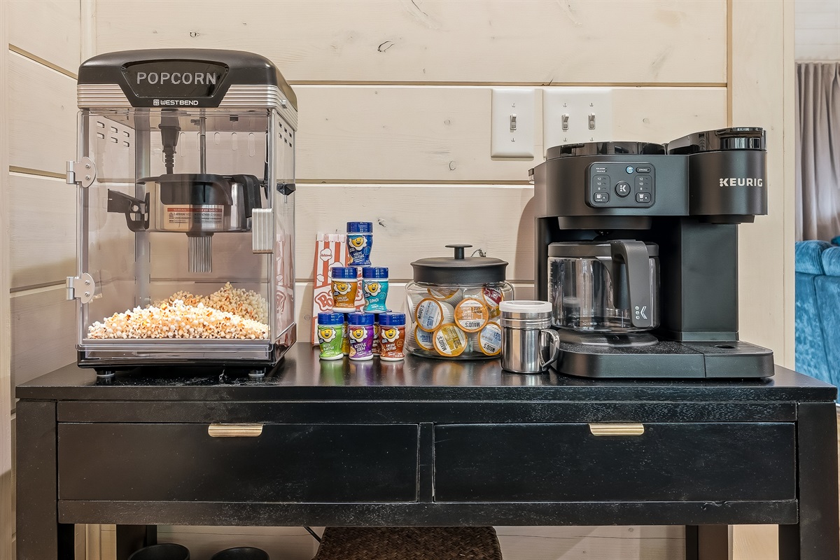 Dedicated coffee and popcorn bar stocked with K cups, flavors, and all the essentials for slow mornings and cozy evenings.