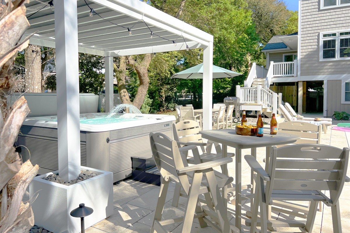 Our new backyard is the ideal place for outdoor dining, lounging in hot tub...