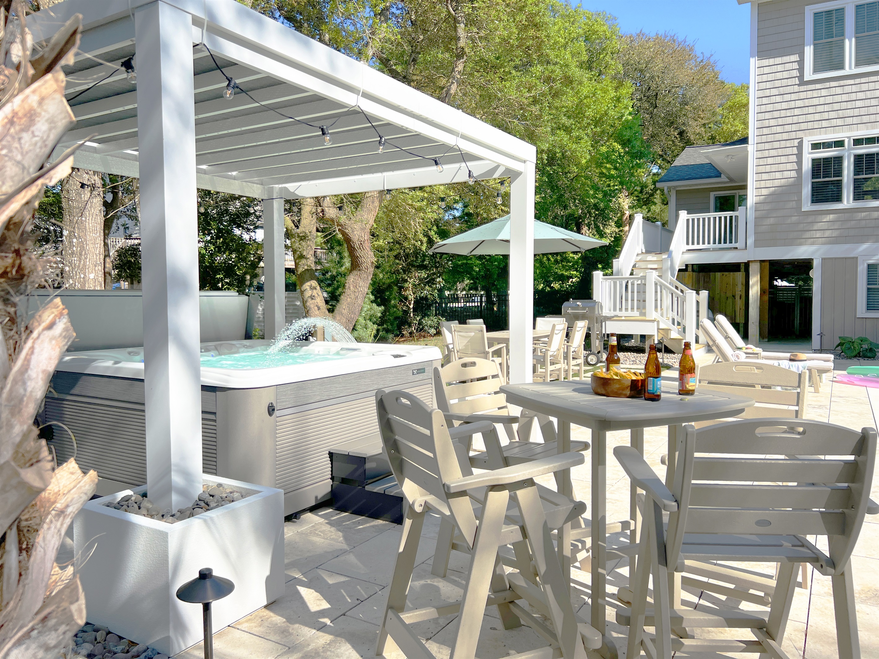 Our new backyard is the ideal place for outdoor dining, lounging in hot tub...