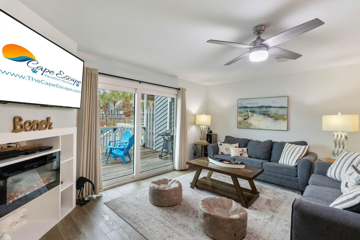 Sink into one of the two full sofas after a long beach day &mdash; the whole group fits in here.