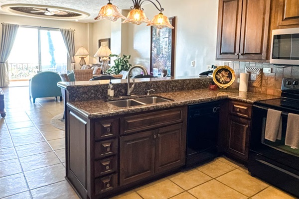 Bright kitchen with breakfast bar seating for two.