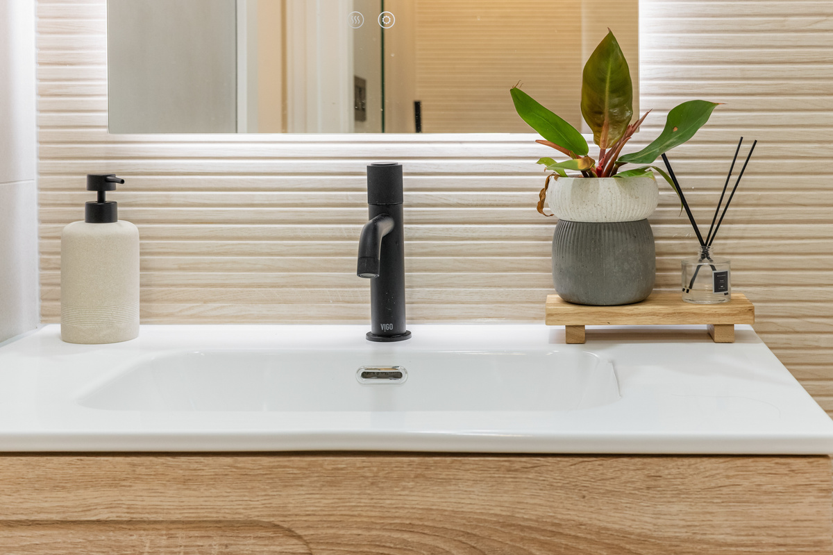 Black fixtures, italian tile, warm oak, good soap