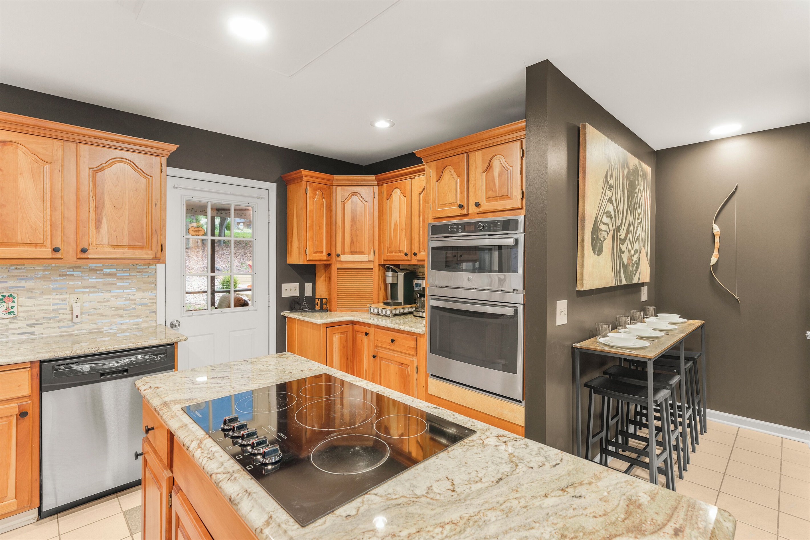 Fully stocked kitchen with stainless appliances
