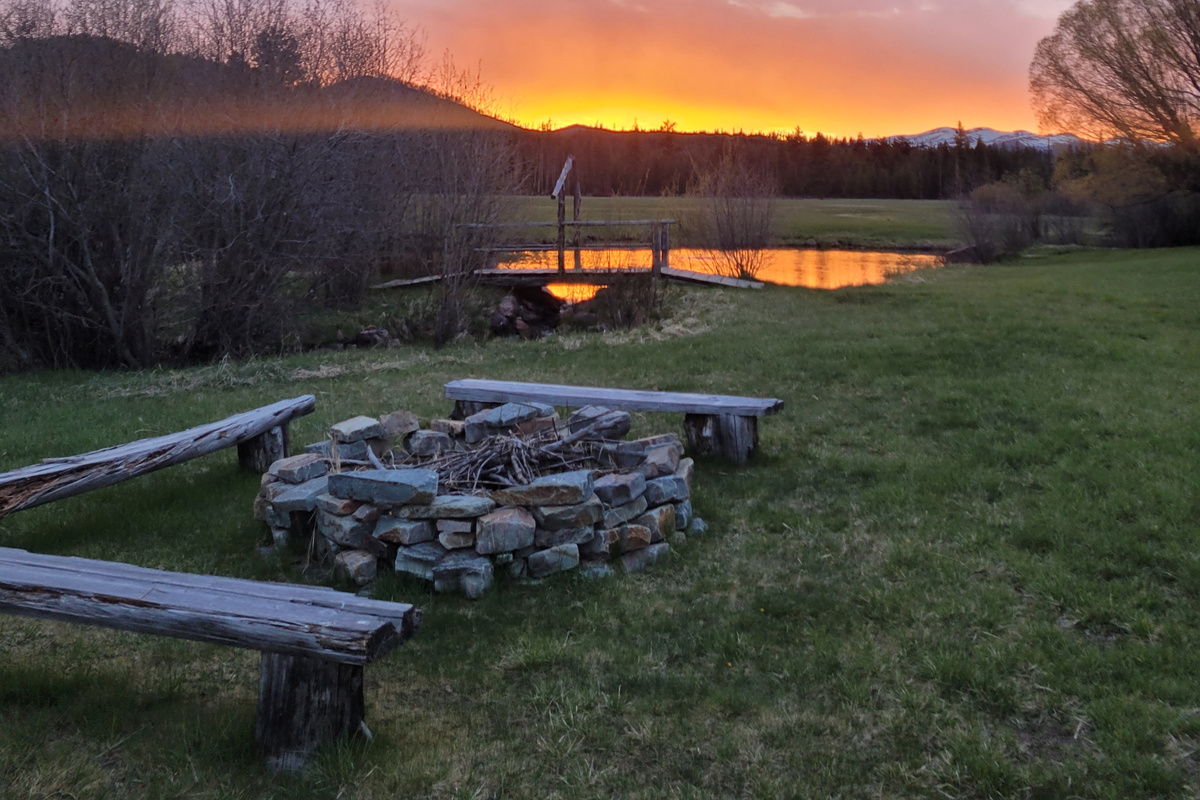 End the evening around the fire under Montana's night sky.