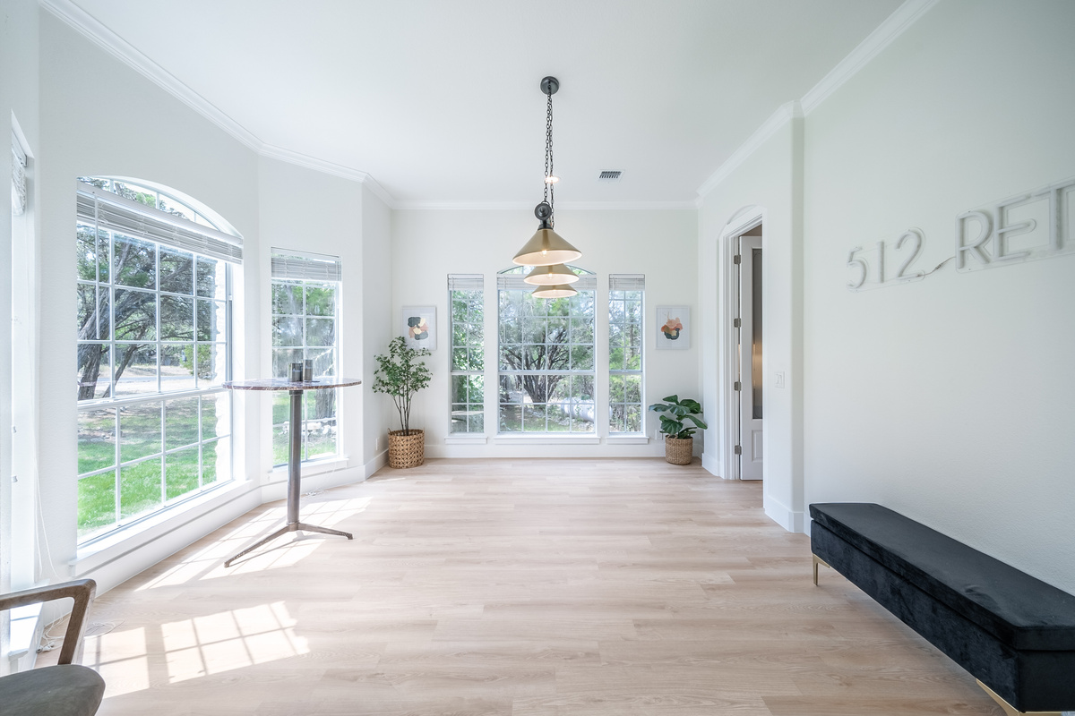 Sunlit multipurpose room, perfect for yoga, games, or extra event space.