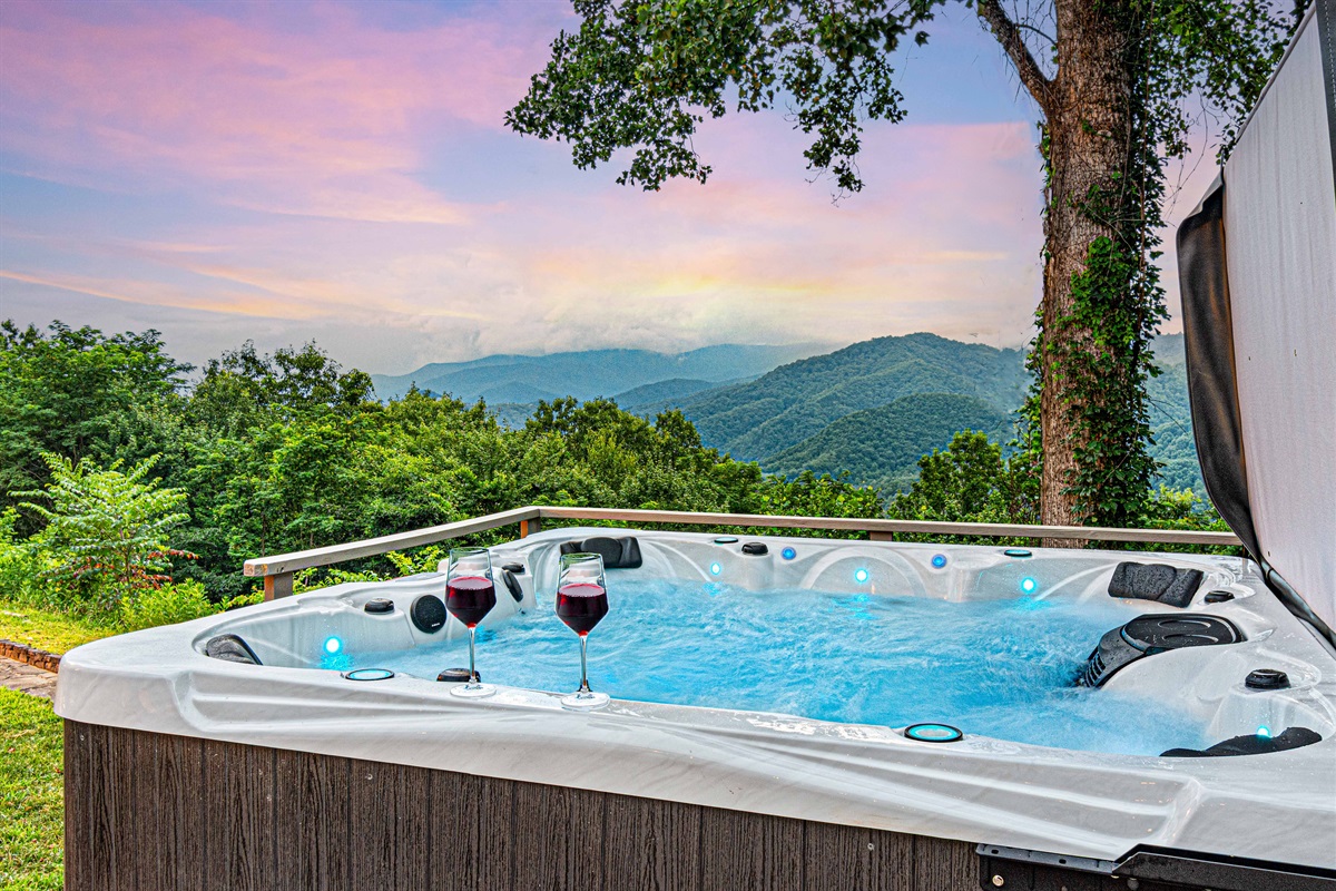 Hot Tub Oasis: Savor stunning mountain views while relaxing in a sparkling hot tub with your drink!