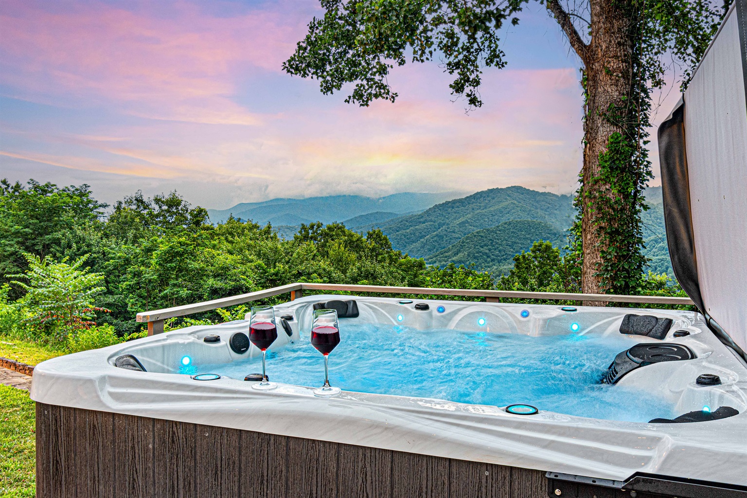 Hot Tub Oasis: Savor stunning mountain views while relaxing in a sparkling hot tub with your drink!