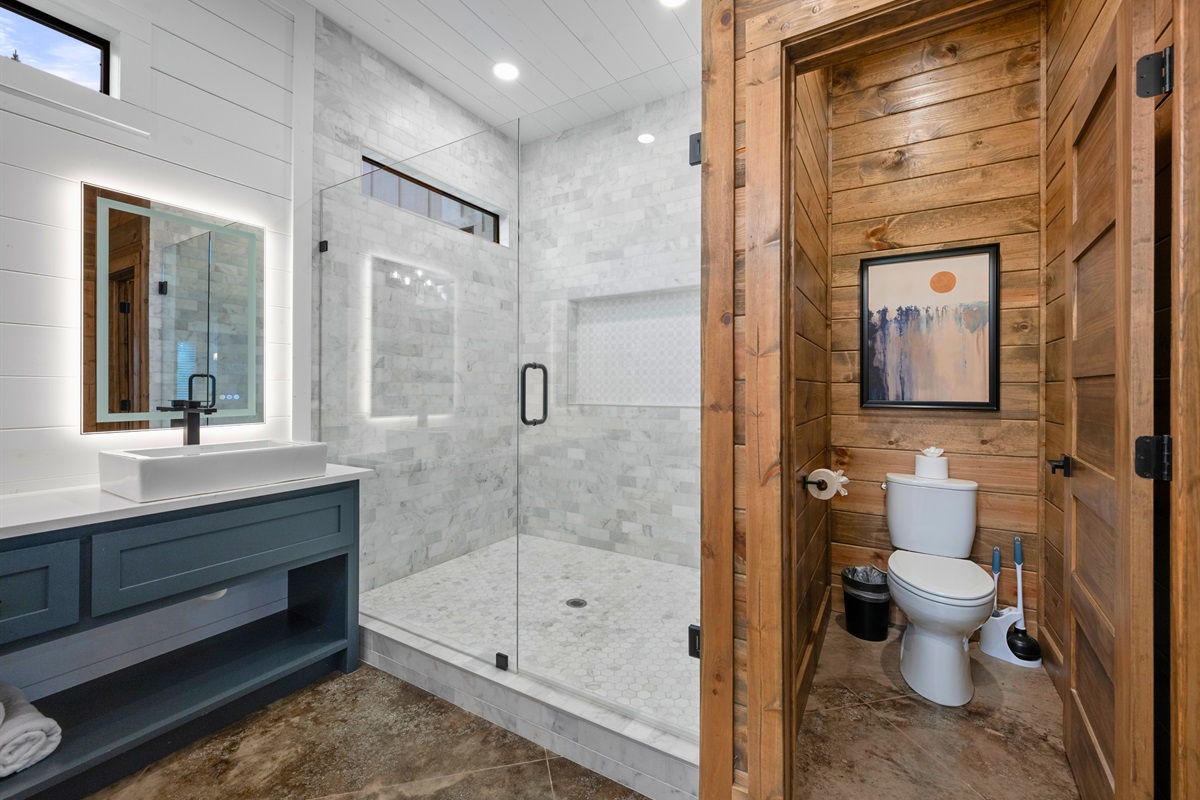 Large tiled walk-in shower in Bathroom 2.