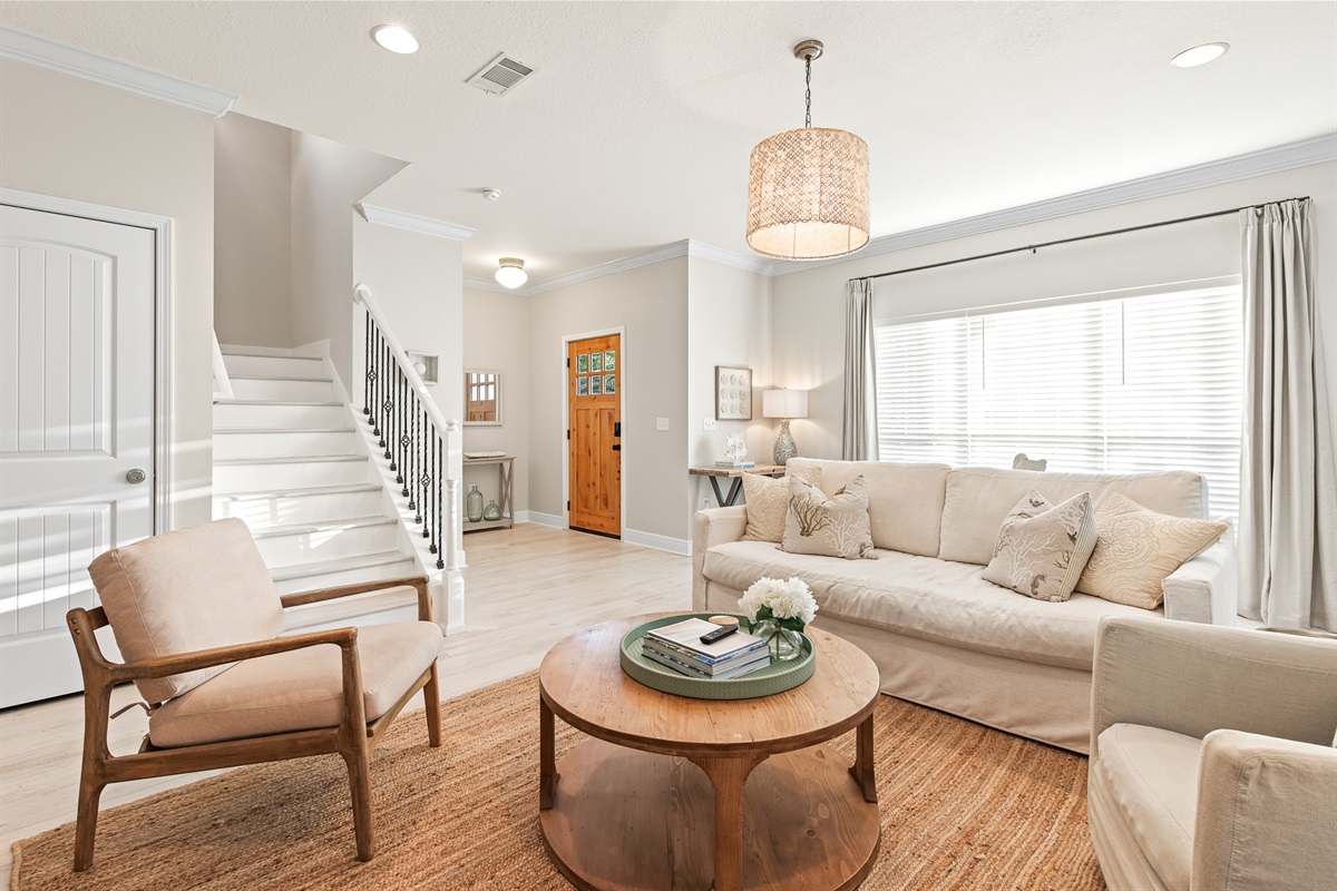 Living Room 1: Sun-drenched and spacious, this inviting lounge is one of two living areas perfect for gathering with family.