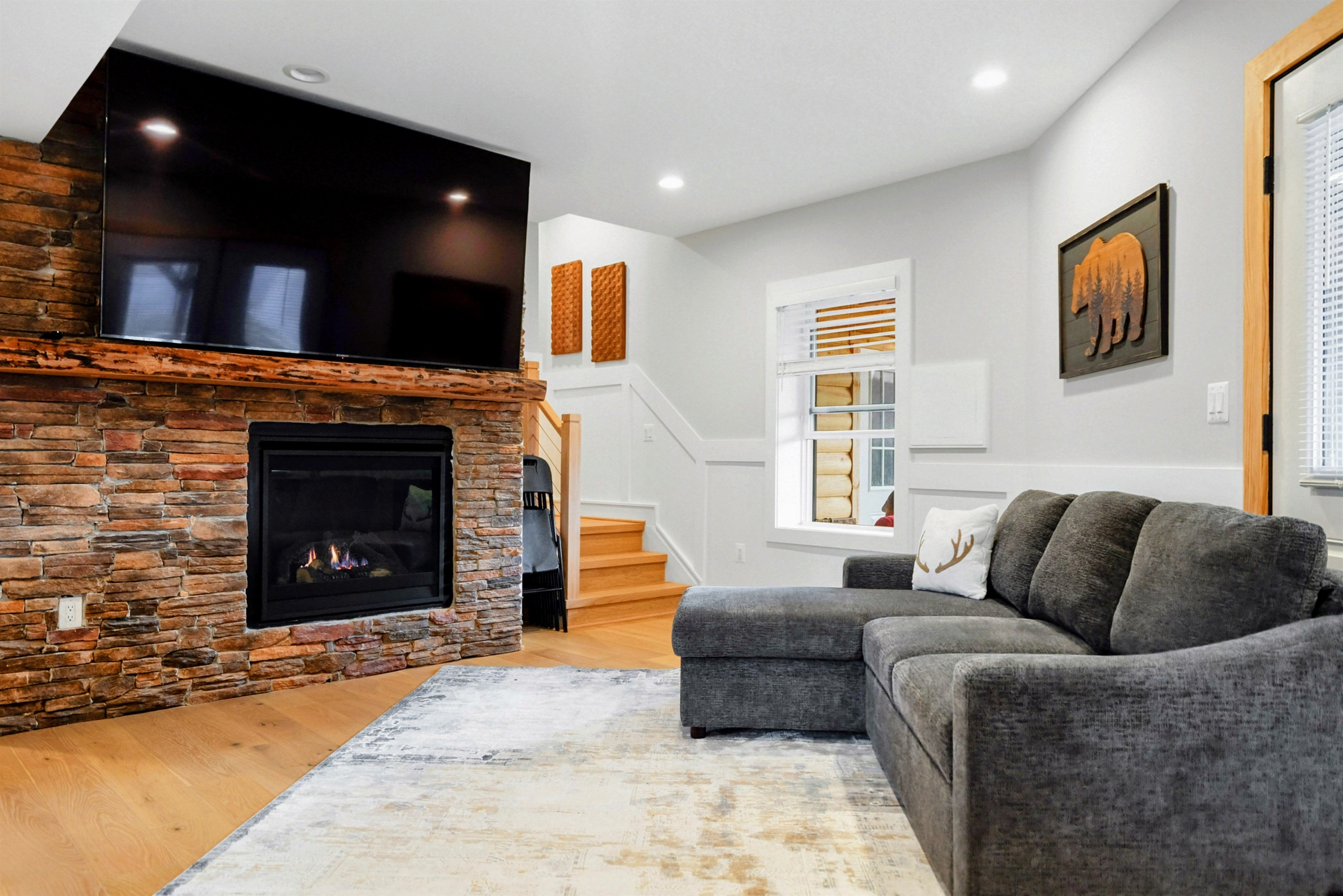 Cozy Up – After a day of adventure, unwind by the fireplace and catch a movie or the big game on the large flat-screen TV.