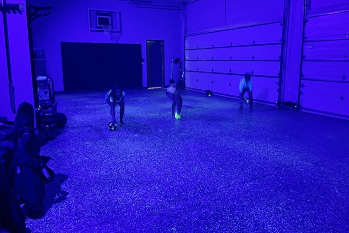 Garage dodgeball in black light with glow in the dark floor