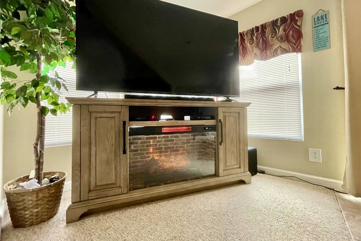 70” smartv with cable tv, dvd player and electric fireplace.
